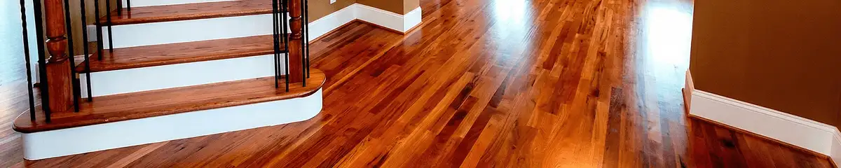 Base floor of a staircase with professionally restored wood flooring in Kansas City KS