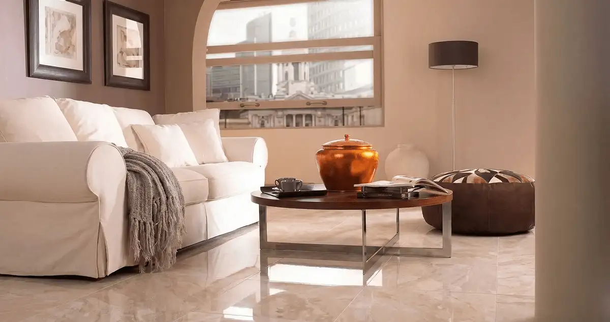 Modern living room with professionally installed marble flooring, a beige sofa, coffee table in Kansas City, KS