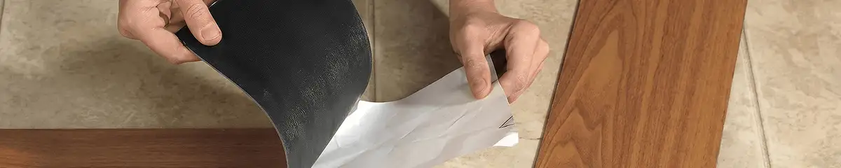 A professional installing vinyl flooring in Kansas City, KS