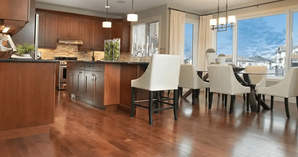 A modern kitchen with professionally installed wood flooring in Kansas City, KS
